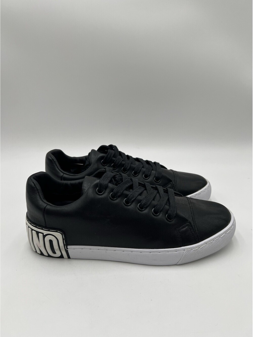Women’s Moschino Low Top  logo-embossed leather sneakers Size 39